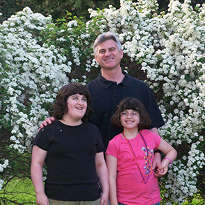 Dad with two daughters with fragile X